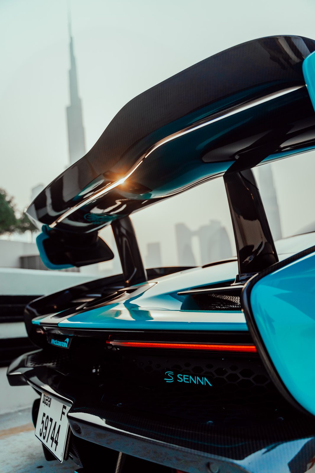 McLaren Senna rear wing with the Burj Khalifa in the haze behind